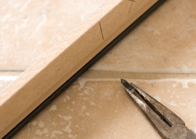 Frame anchor pulled out with a pair of pliers